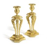 A PAIR OF REGENCY GILT BRONZE CANDLESTICKS AFTER A DESIGN BY CHENEY OF LONDON, EARLY 19TH CENTURY