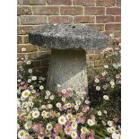 A SET OF THREE COMPOSITE STONE BALL FINIALS 20TH CENTURY together with a staddle stone (4) balls