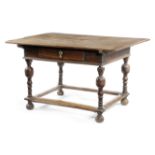 A DUTCH OAK TABLE 17TH CENTURY the planked top above a single frieze drawer on turned cup and