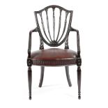 A MAHOGANY ARMCHAIR IN HEPPLEWHITE STYLE LATE 19TH / EARLY 20TH CENTURY with a shield back,
