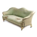 A VICTORIAN SERPENTINE SOFA MID-19TH CENTURY on giltwood supports and brass castors, with loose