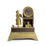 A FRENCH EMPIRE GILT AND PATINATED BRONZE MANTEL CLOCK EARLY 19TH CENTURY the brass eight day drum