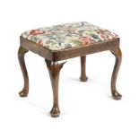 A GEORGE II ELM STOOL C.1730 with a later needlework drop-in seat, on cabriole legs and pad feet