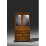 A GEORGE II BURR WALNUT AND WALNUT SECRETAIRE CABINET ON CHEST C.1730 with cross and feather