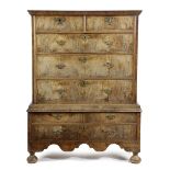 A QUEEN ANNE WALNUT CHEST ON STAND EARLY 18TH CENTURY the veneered top above two short and three