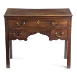 AN EARLY GEORGE III MAHOGANY LOWBOY C.1760 fitted with three drawers, above a shaped apron 71cm