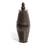 A TREEN LIGNUM VITAE COFFEE GRINDER EARLY / MID-19TH CENTURY of bullet form, in three sections, with