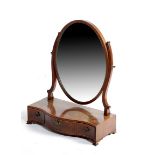 A GEORGE III MAHOGANY AND BOXWOOD SERPENTINE DRESSING TABLE MIRROR C.1780 the oval plate on scroll