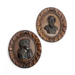 A PAIR OF CARVED AND STAINED OAK OVAL PORTRAIT PANELS 19TH CENTURY depicting Shakespeare and Byron