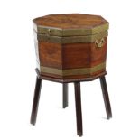 A GEORGE III MAHOGANY OCTAGONAL WINE COOLER ON STAND C.1790-1800 brass bound, the hinged lid