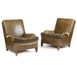 A PAIR OF LEATHER EASY ARMCHAIRS IN HOWARD STYLE EARLY TO MID-20TH CENTURY each with a later cushion