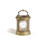 A FRENCH BRASS MINIATURE OVAL CARRIAGE TIMEPIECE LATE 19TH CENTURY the brass movement with a