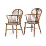 TWO VICTORIAN YEW LOW BACK WINDSOR ARMCHAIRS C.1840 each with a pierced splat back on turned legs,
