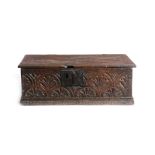 AN OAK BIBLE BOX POSSIBLY SCOTTISH, MID-17TH CENTURY the lid with later hinges, carved with flower