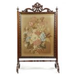 λ A LARGE EARLY VICTORIAN ROSEWOOD COUNTRY HOUSE FIRESCREEN C.1840 with a carved leaf and scroll,