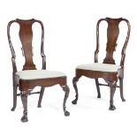 A PAIR OF GEORGE II IRISH MAHOGANY SIDE CHAIRS C.1740-50 each with a curved solid vase shaped splat,