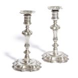 A MATCHED PAIR OF ANGLO-CHINESE PAKTONG CANDLESTICKS 18TH CENTURY AND LATER each with a foliate