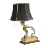 A GILT METAL CHERUB TABLE LAMP 20TH CENTURY modelled as a cherub supporting a cornucopia, on a