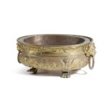 A DUTCH BRASS OVAL JARDINIERE 19TH CENTURY with repousse decoration and with lion's mask ring