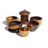A TREEN LIGNUM VITAE STRING BOX AND COVER 19TH CENTURY of cylindrical form, together with five