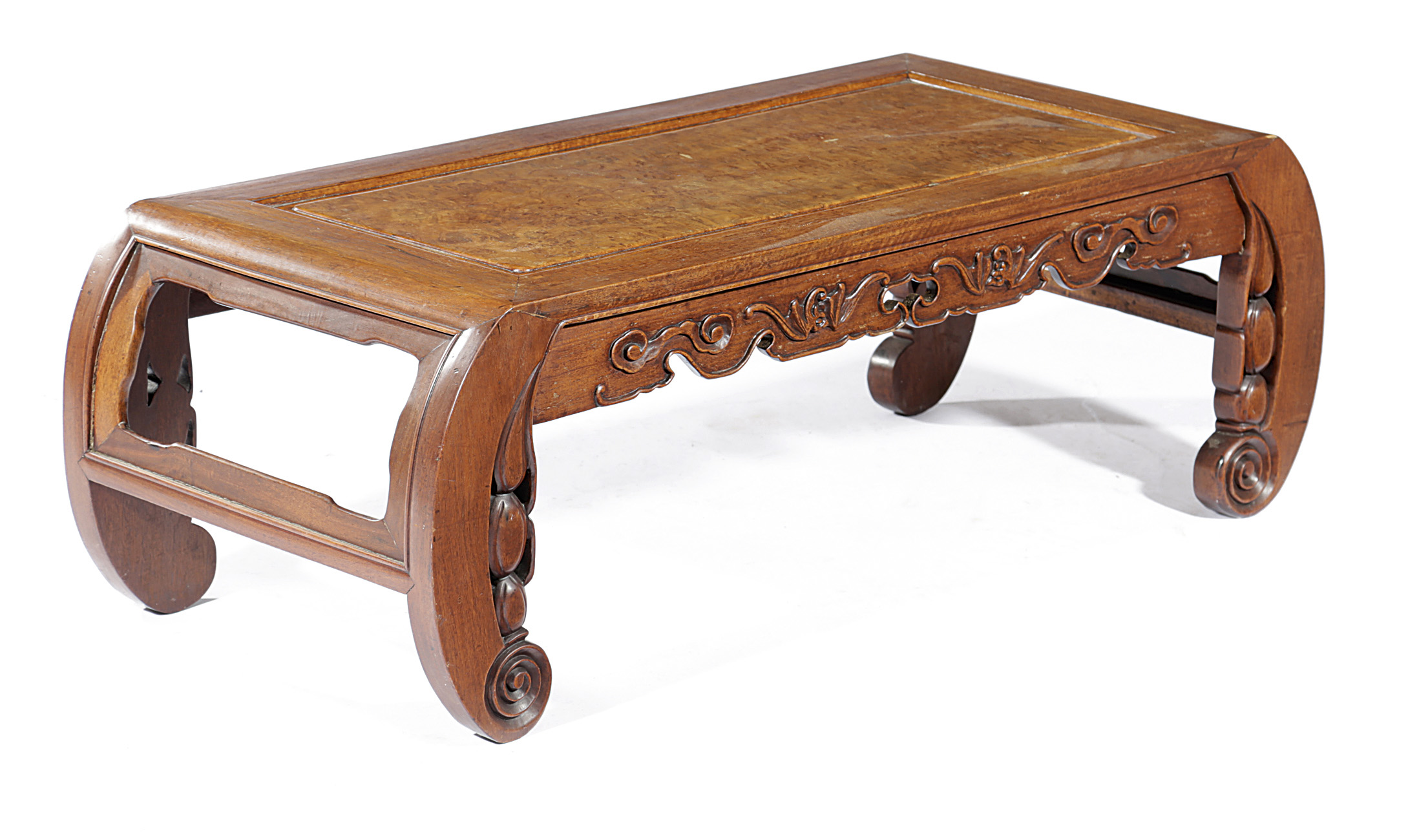 A CHINESE PADOUK KANG TABLE LATE 19TH CENTURY the top with a burr panel, above a frieze carved