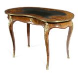 A VICTORIAN WALNUT AND MARQUETRY WRITING TABLE IN LOUIS XV STYLE C.1870 of kidney shape, with gilt