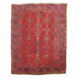 AN USHAK CARPET CENTRAL / WESTERN ANATOLIA, C.1910 the tomato red field with columns of medallions