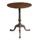 AN EARLY GEORGE III MAHOGANY TRIPOD OCCASIONAL TABLE C.1760-70 the circular tilt-top with a pie-