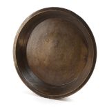 A TREEN DAIRY BOWL 19TH CENTURY possibly ash, with banded decoration 53.5cm diameter