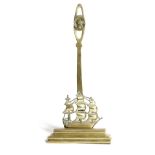 NELSON INTEREST. A VICTORIAN BRASS DOORSTOP IN THE FORM OF HMS VICTORY LATE 19TH CENTURY the pierced