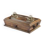 λ A VICTORIAN ROSEWOOD AND BRONZE MOUNTED PARTNERS DESK STAND C.1840-50 a central well, flanked by