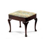 A GEORGE II RED WALNUT STOOL C.1730 with a later needlework drop-in seat, on cabriole legs and pad