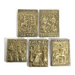 A GROUP OF FIVE PERSIAN EMBOSSED BRASS PLAQUES PROBABLY TEHRAN, LATE 19TH CENTURY depicting