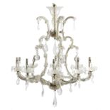 A GLASS ELEVEN-LIGHT CHANDELIER EARLY 20TH CENTURY of open scroll form, applied with flowerheads and