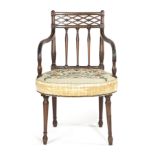 A LATE GEORGE III MAHOGANY ARMCHAIR C.1800-1805 the lattice top rail carved with flowerheads above