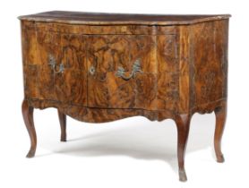 AN ITALIAN WALNUT COMMODE 18TH CENTURY AND LATER the shaped quarter veneered top above a pair of