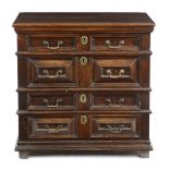 A WILLIAM AND MARY WALNUT CHEST LATE 17TH CENTURY fitted with four long drawers with panelled fronts