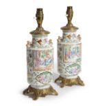 A PAIR OF CHINESE CANTON PORCELAIN FAMILLE ROSE VASE TABLE LAMPS LATE 19TH CENTURY painted with