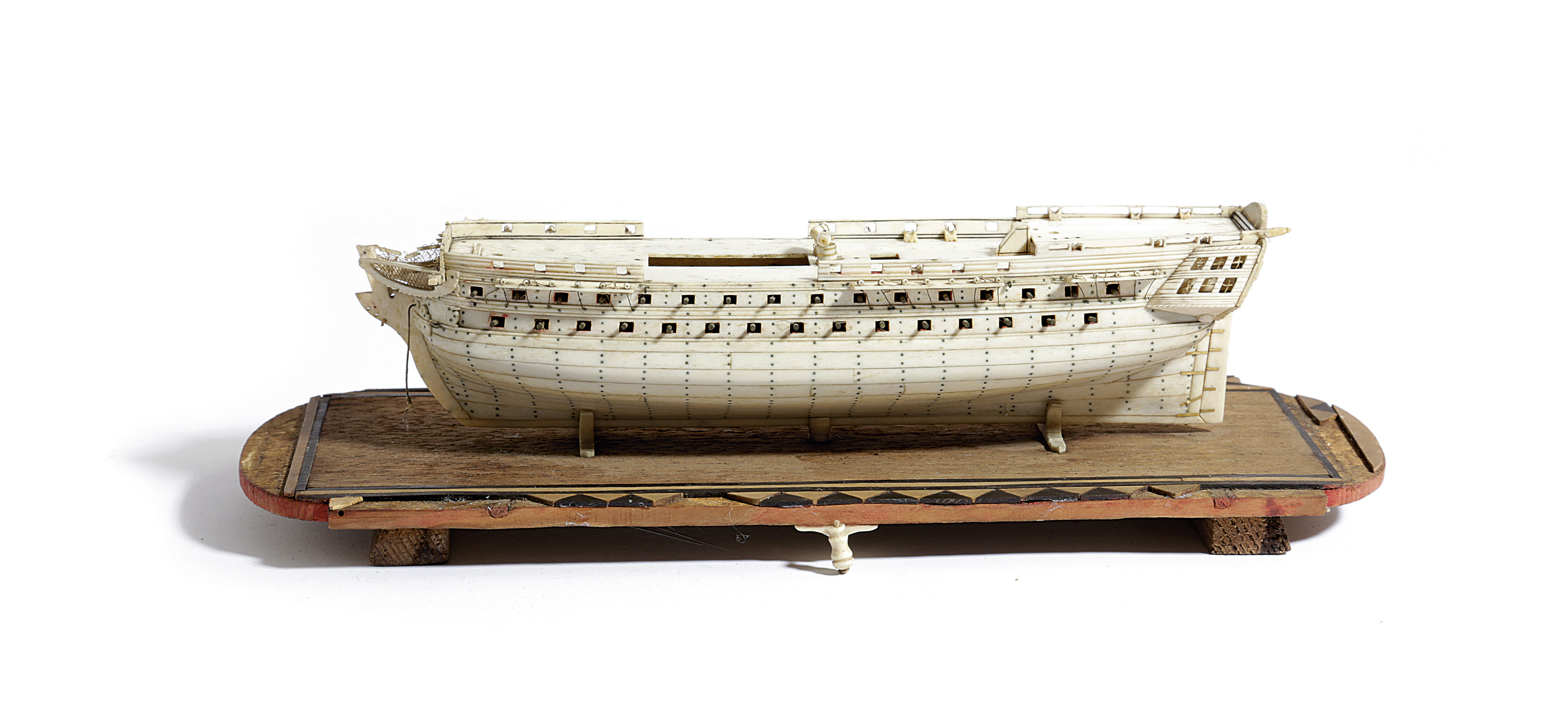 A NAPOLEONIC PRISONER OF WAR BONE SHIP MODEL EARLY 19TH CENTURY with a planked and pinned hull, with