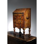 A DIMINUTIVE BURR WALNUT BUREAU PROBABLY EARLY 18TH CENTURY with cross and feather banding, the