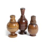 THREE TREEN FLASKS OR POUNCE POTS 19TH CENTURY in boxwood and fruitwood, the detachable covers on
