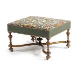 A VICTORIAN WALNUT STOOL IN WILLIAM AND MARY STYLE LATE 19TH CENTURY with a needlework seat, on