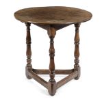 AN OAK CRICKET TABLE EARLY 18TH CENTURY AND LATER the circular top on turned twin baluster and cup