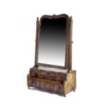 A GEORGE I WALNUT DRESSING TABLE MIRROR EARLY 18TH CENTURY the arched plate in a moulded slip, above