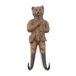 A BLACK FOREST LINDENWOOD COAT HOOK LATE 19TH / EARLY 20TH CENTURY in the form of a fox, with twin