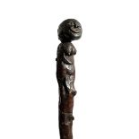 A FOLK ART FIGURAL WALKING STICK OR KNOBKERRIE 19TH CENTURY possibly yew, the carved wooden head