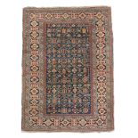 A SHIRVAN RUG SOUTH EAST CAUCASUS, C.1890 the indigo field with columns of angular stylised