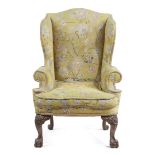 A WALNUT WING ARMCHAIR IN GEORGE I STYLE LATE 19TH / EARLY 20TH CENTURY covered in petit and gros