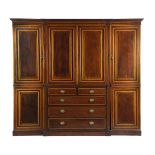 AN EDWARDIAN MAHOGANY BREAKFRONT COMPACTUM WARDROBE EARLY 20TH CENTURY inlaid with stringing and