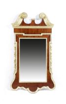 A GEORGE II MAHOGANY AND GILTWOOD WALL MIRROR C.1735-40 the later bevelled plate within a carved